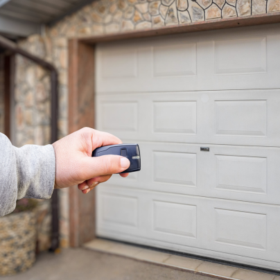 Wausau security key fob pointing to a garage door